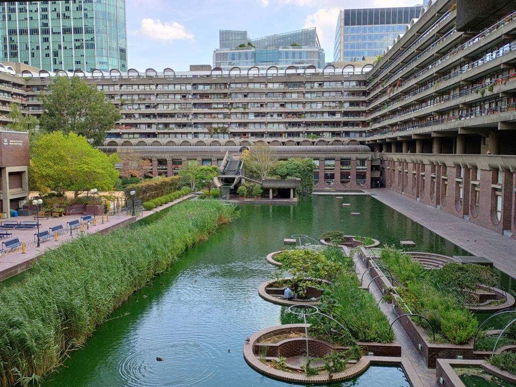 Interior view of the Barbican in London, with an artificial lake and a waterfall