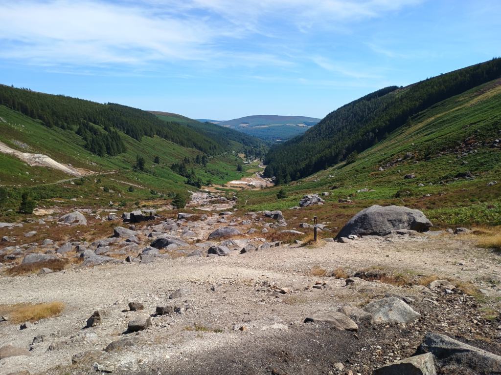 A stunning view through the Wicklow Gap in Ireland, showing the scattered granite blocks between two of the mountains.